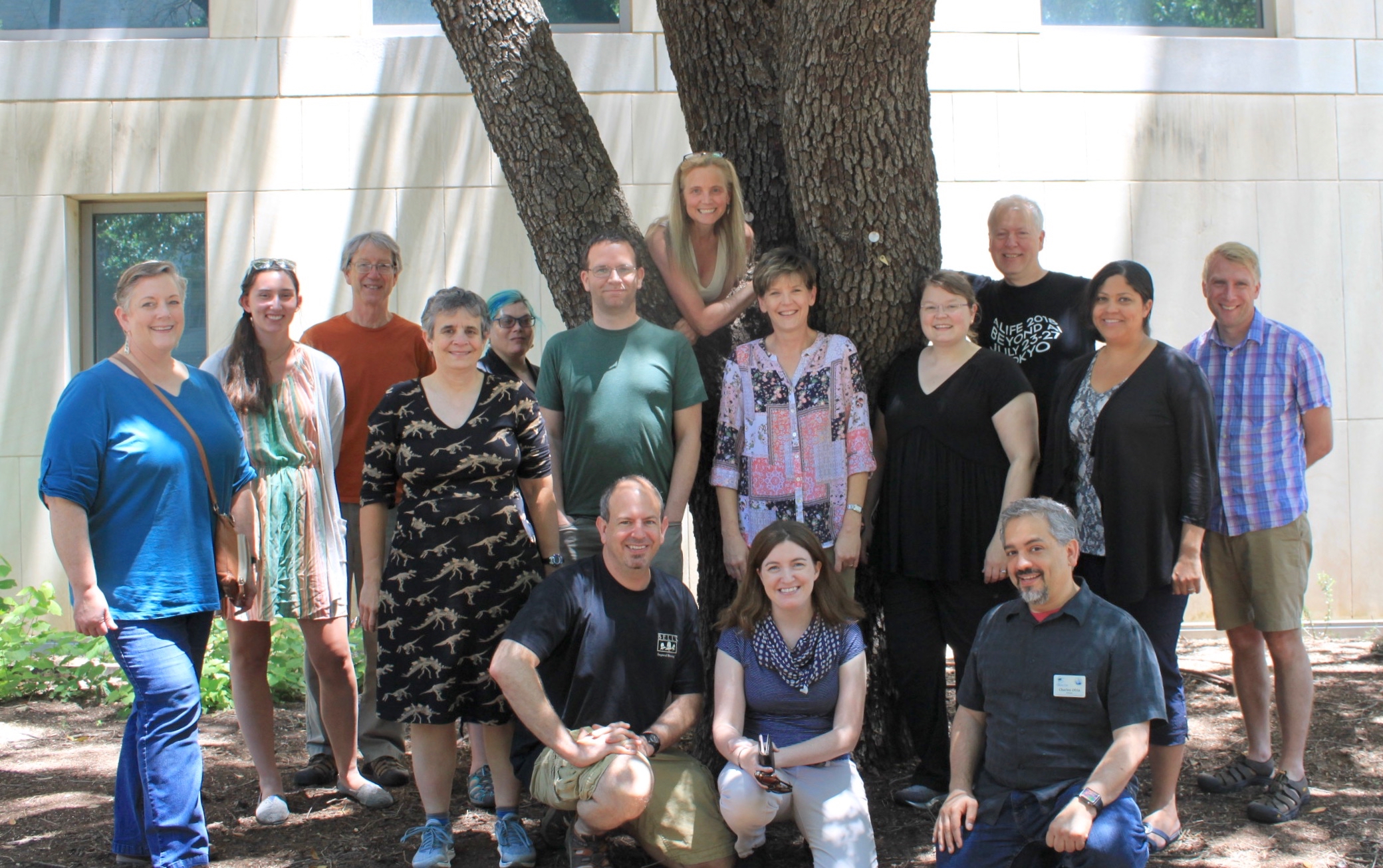 group of participants and instructors under oak tree at UT Austin